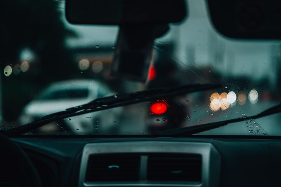 Close up of a severely cracked car windshield requiring replacement